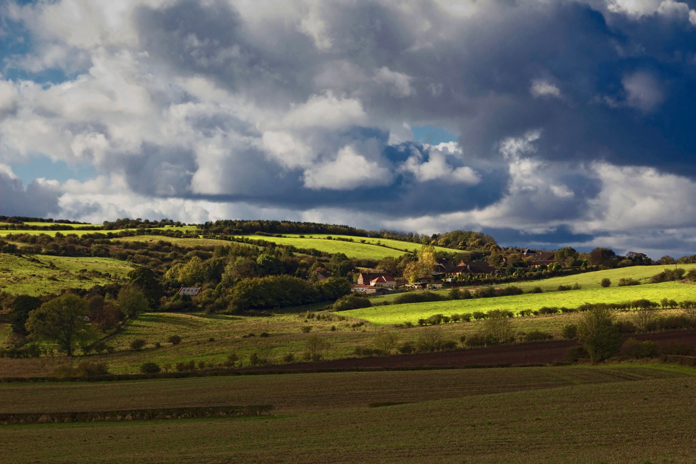 Rolling downland under a broken sky